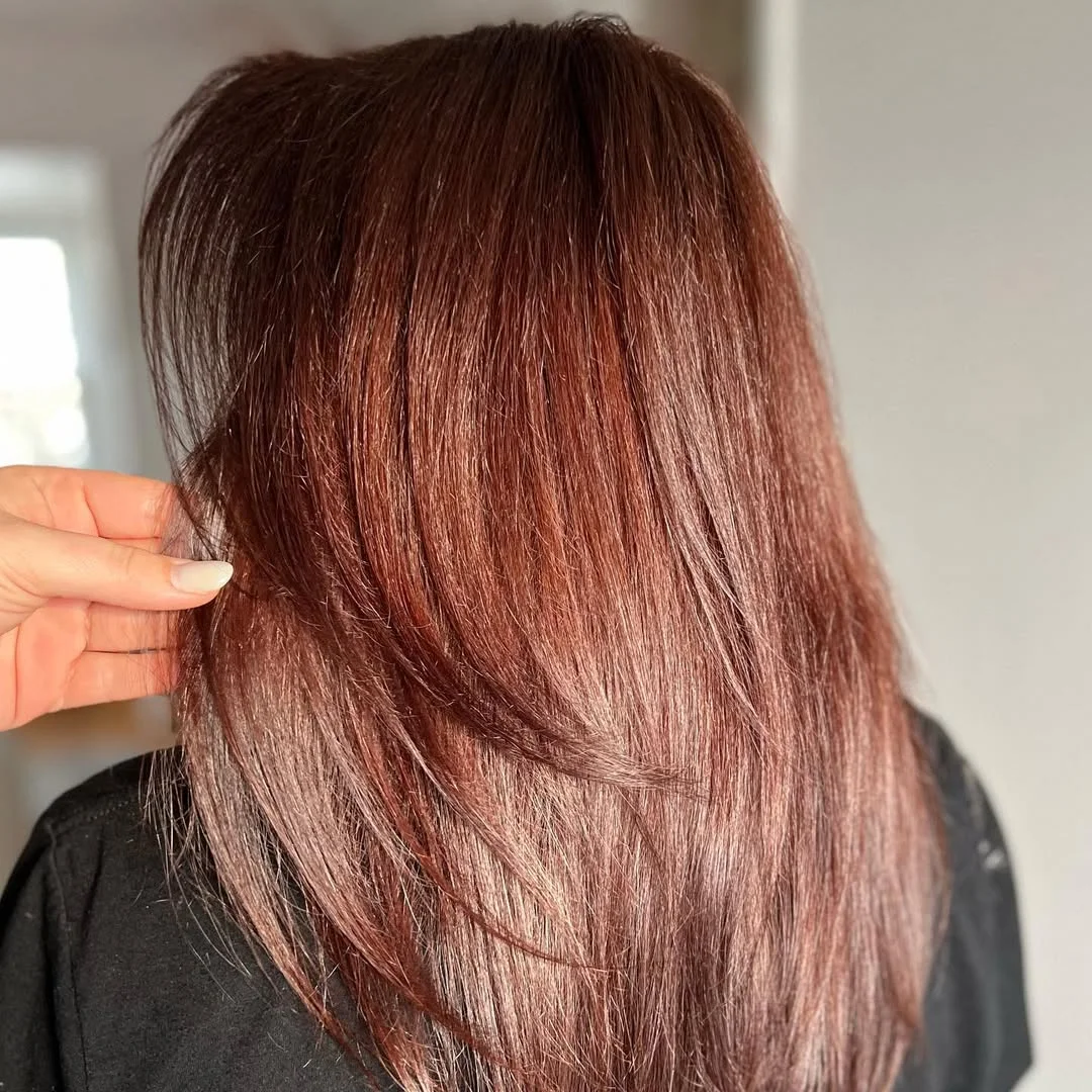 warm summer auburn hair color 2026 Wine Auburn Layers With A Glassy Finish