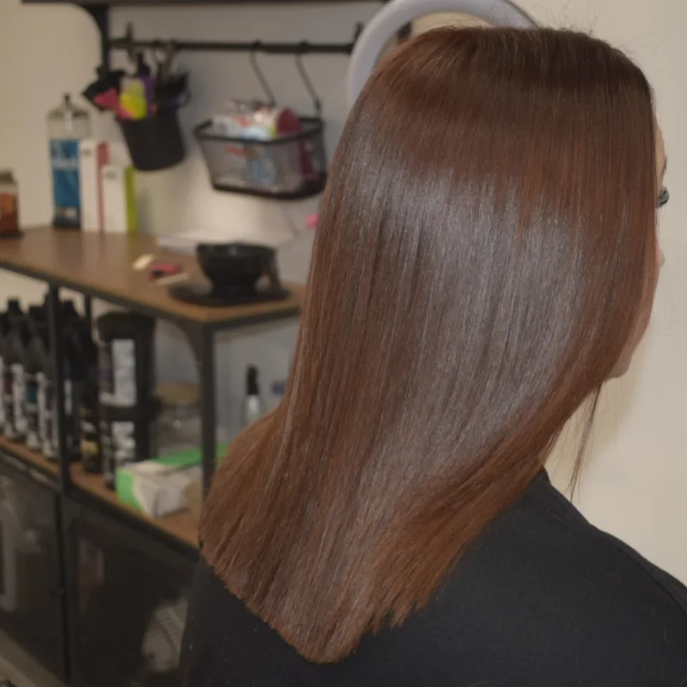 warm summer auburn hair color 2026 Muted Auburn Brown For Minimalist Shine