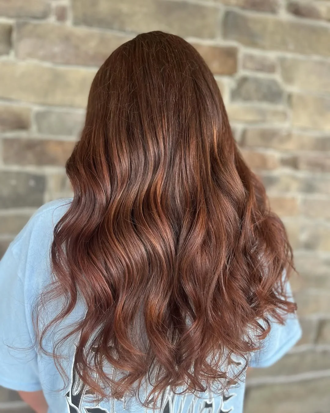 warm summer auburn hair color 2026 Muted Rose Auburn Waves With Romantic Softness