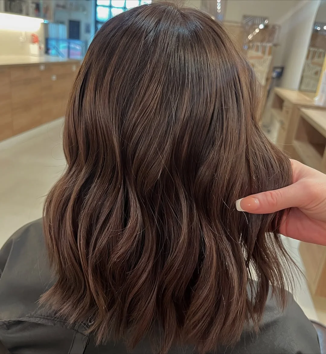warm summer brunette hair color 2026 Cool Brunette Lob With Soft Natural Texture