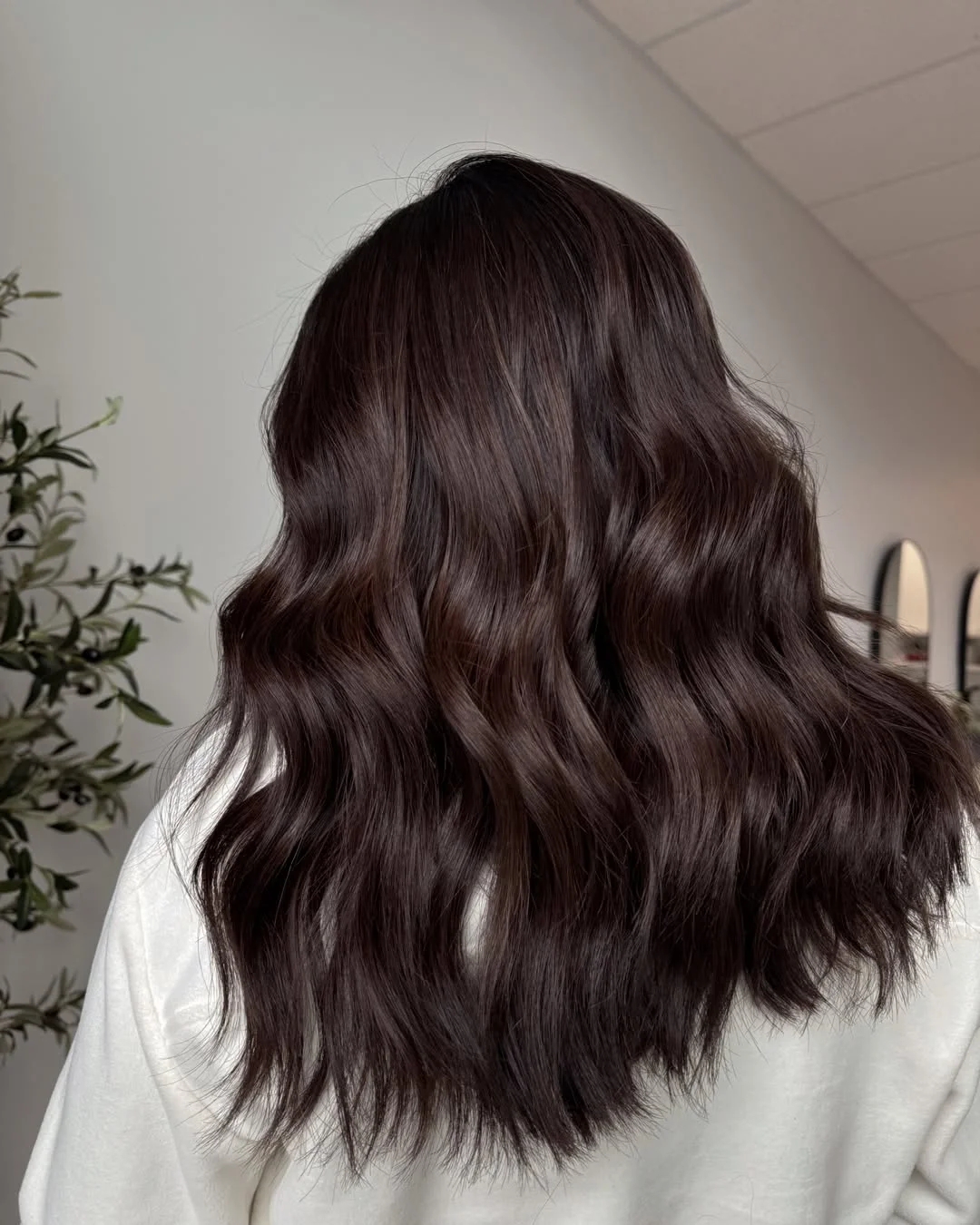 warm summer brunette hair color 2026 Velvet Cocoa Waves With a Soft Luxe Finish