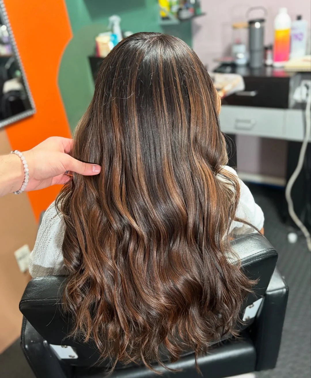 warm summer brunette hair color 2026 Ribboned Brunette Waves With Soft Caramel Shine
