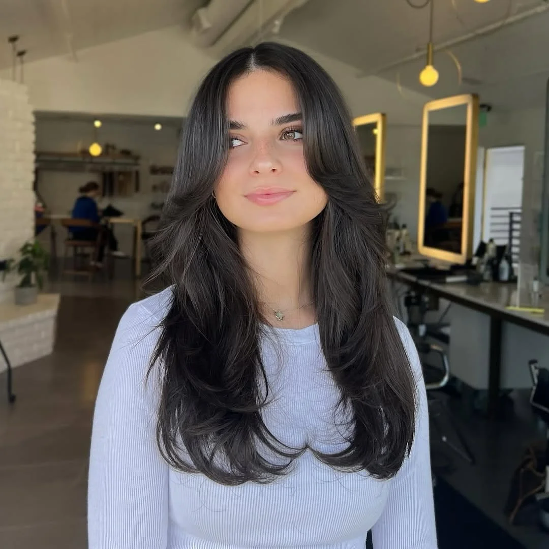 warm summer brunette hair color 2026 Soft Black Brunette Layers With Airy Movement