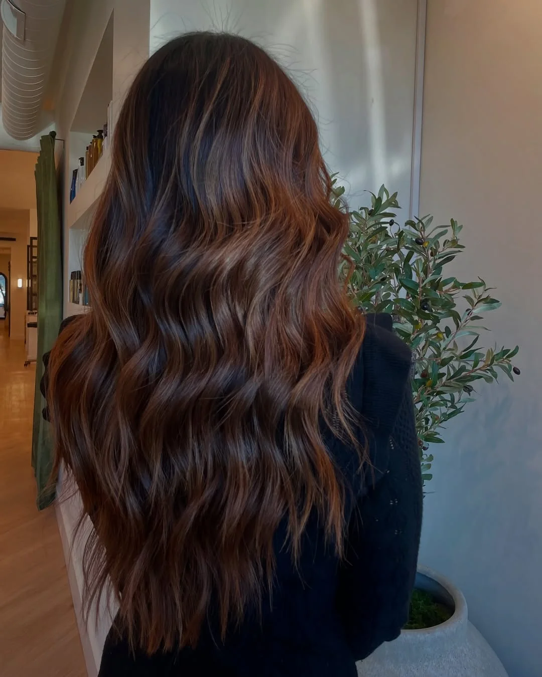 warm summer brunette hair color 2026 Warm Mocha Waves With Soft Summer Dimension