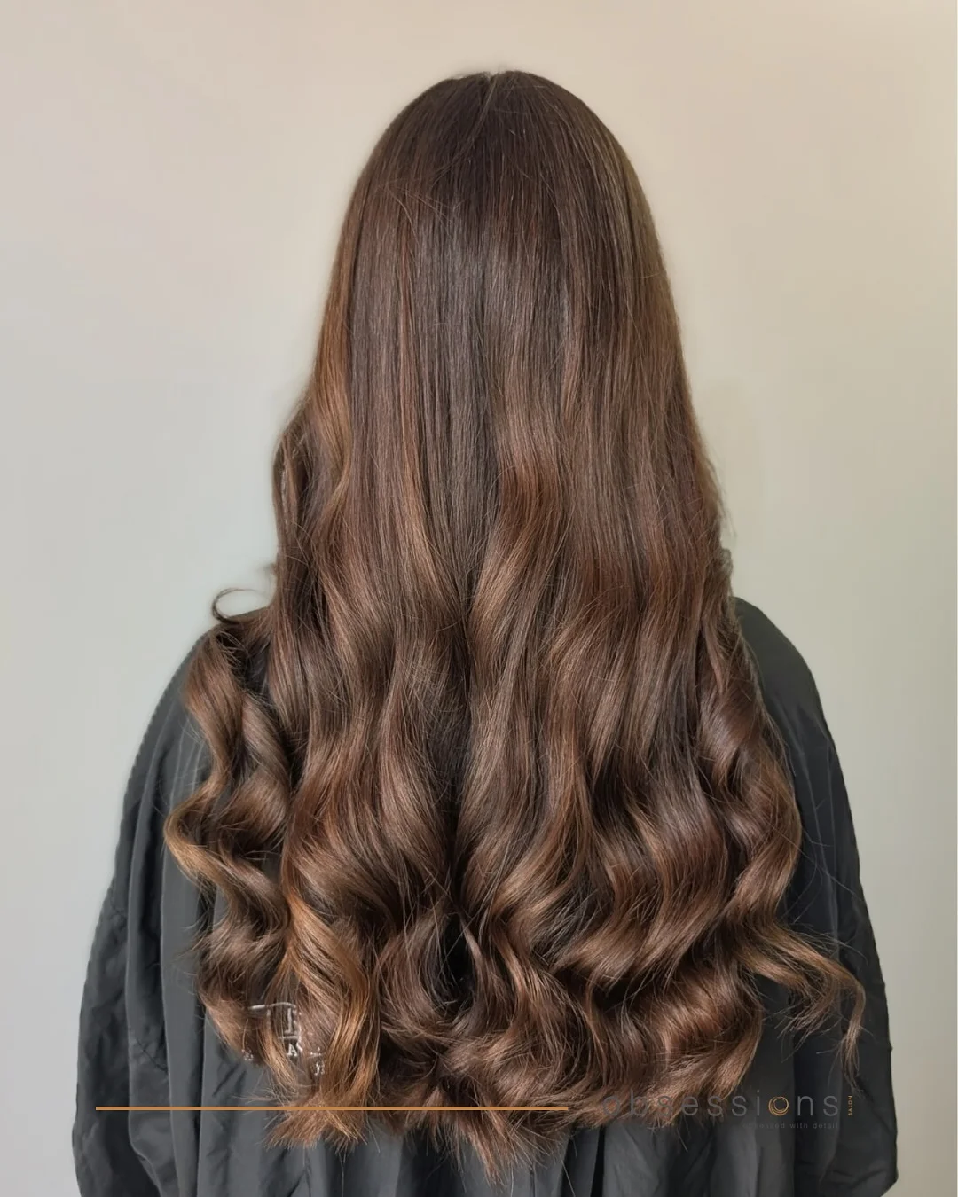 warm summer brunette hair color 2026 Soft Mocha Curls With Warm Brunette Glow