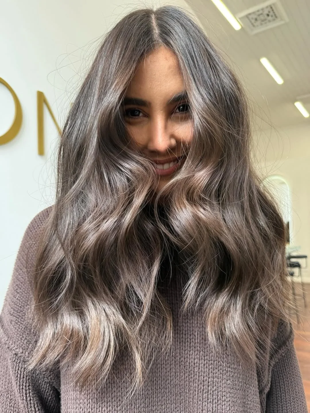 warm summer brunette hair color 2026 Soft Smoky Brunette With Cool-Girl Shine