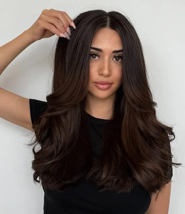 warm summer brunette hair color 2026 Deep Chocolate Brunette With Full Layered Volume