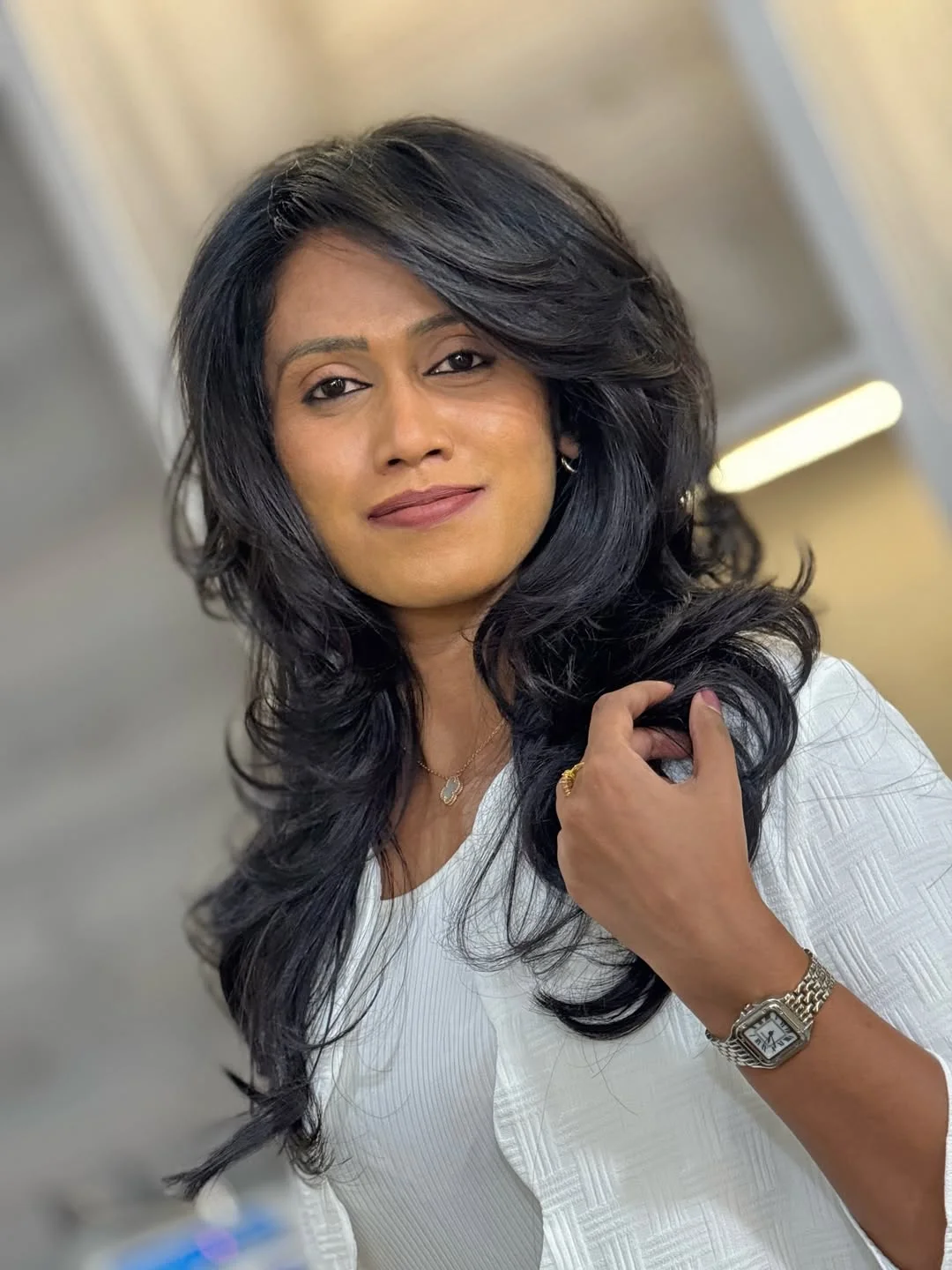 youthful summer haircuts for women over 40 2026 Glossy Long Layers With Side-Swept Drama