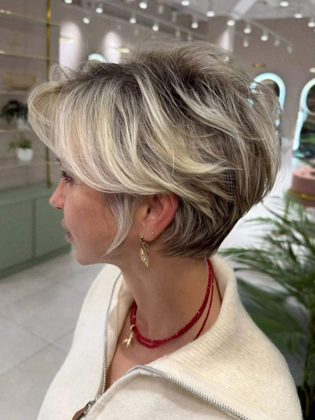 youthful summer haircuts for women over 40 2026 Dimensional Blonde Pixie Bob With Feathered Texture