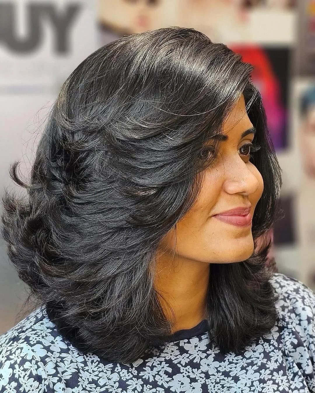 youthful summer haircuts for women over 40 2026 Glossy Layered Black Cut With Face-Framing Volume