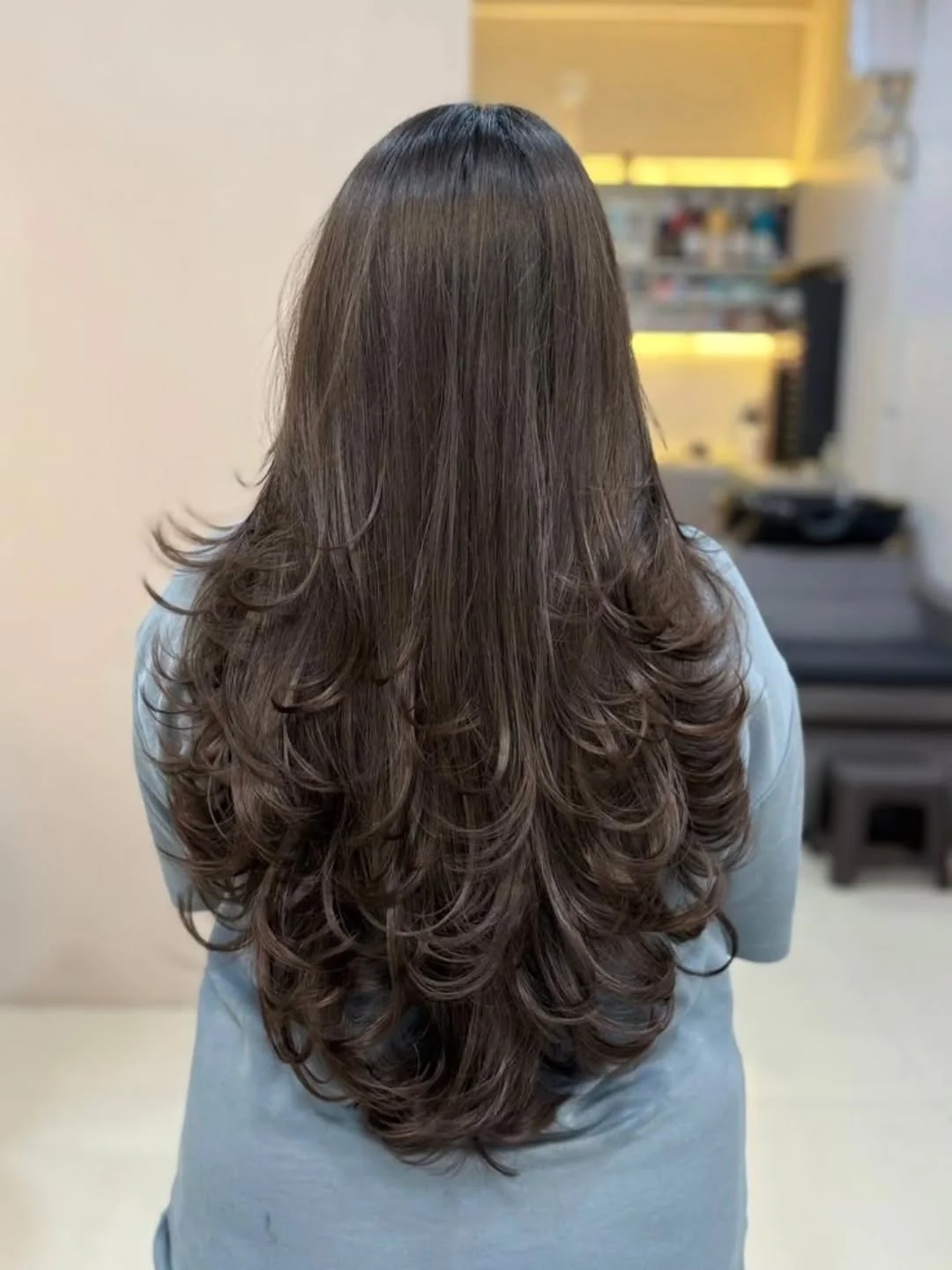 youthful summer haircuts for women over 40 2026 Long Feathered Layers With Soft Summer Movement