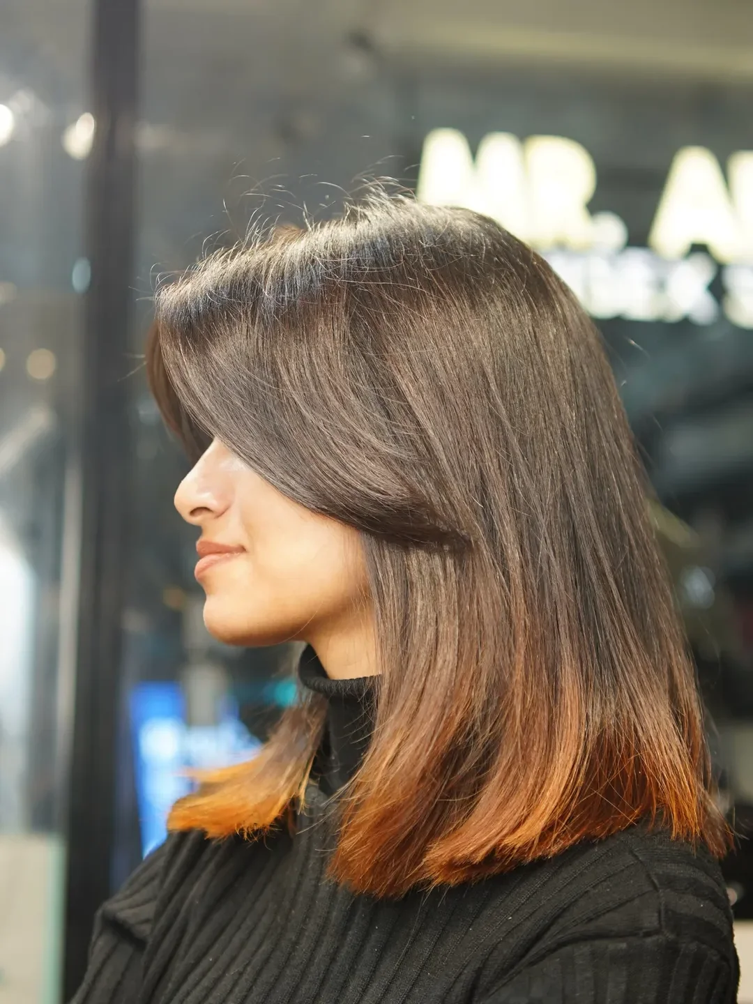 youthful summer haircuts for women over 40 2026 Straight Shoulder-Length Lob With Warm Copper Ends