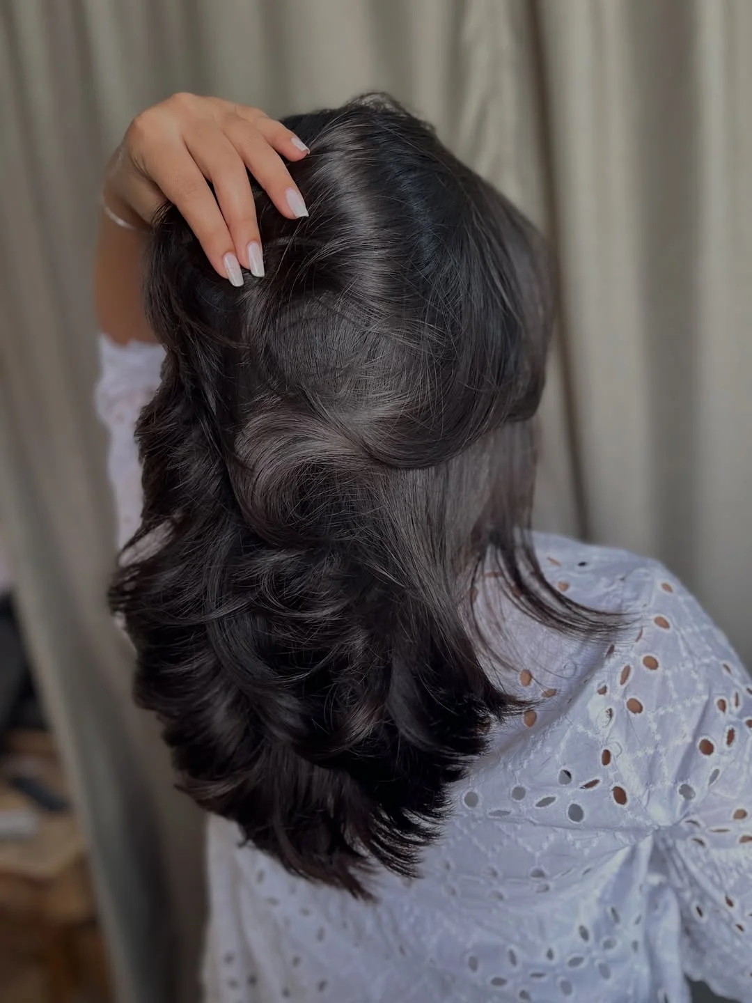 youthful summer haircuts for women over 40 2026 Glossy Medium Layers With Retro Flip Energy