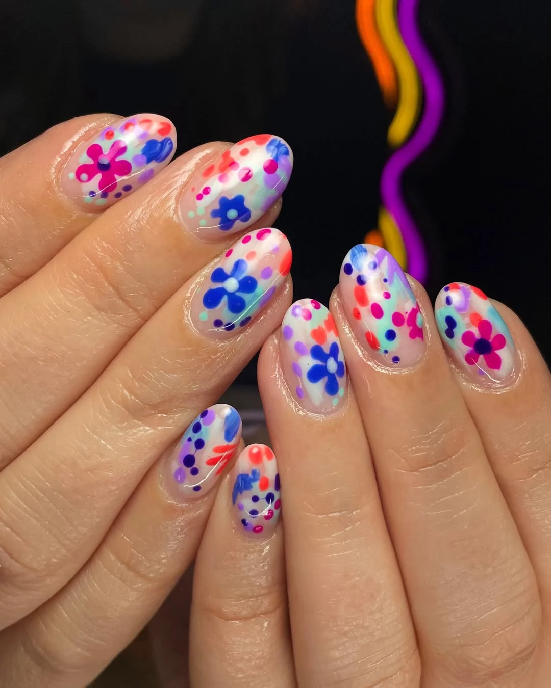 bright summer nails 2026 Sheer Abstract Floral Nails In Blue, Violet, And Neon Pink