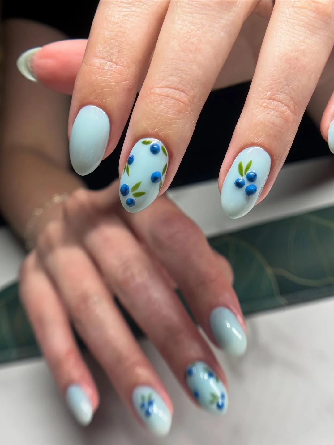 bright summer nails 2026 Powder Blue Berry Nails With Minimal Botanical Charm