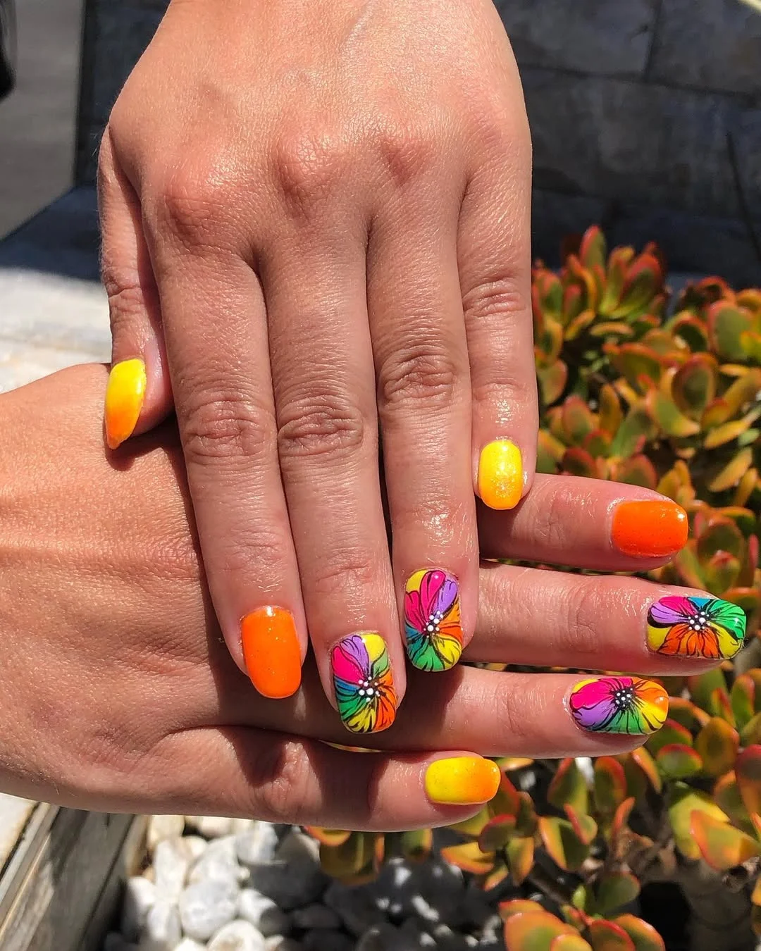 bright summer nails 2026 Sunset Orange Florals With Rainbow Petal Accents