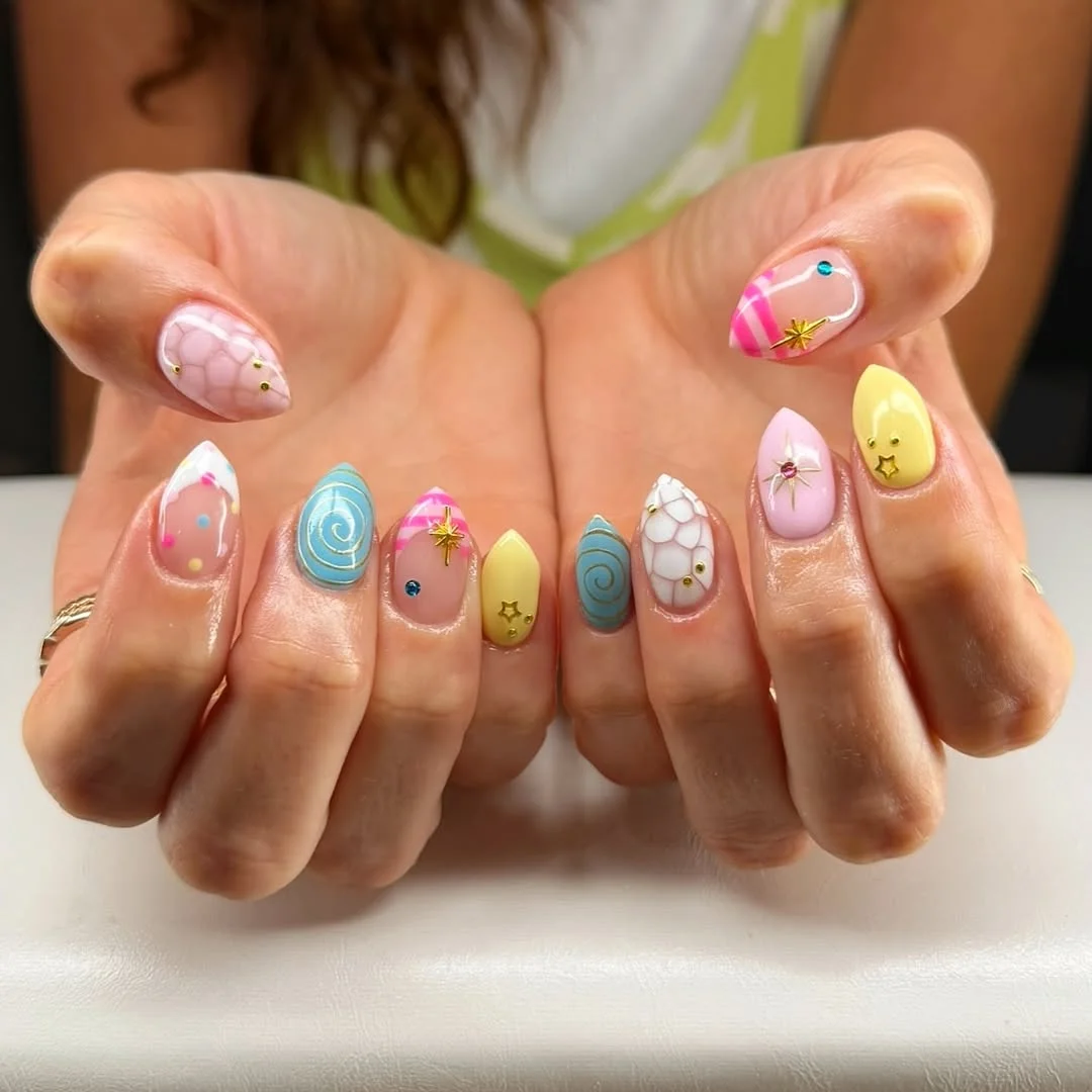 funky summer nails 2026 Pastel Candy Almond Nails With Swirls, Stars, And Marble Details