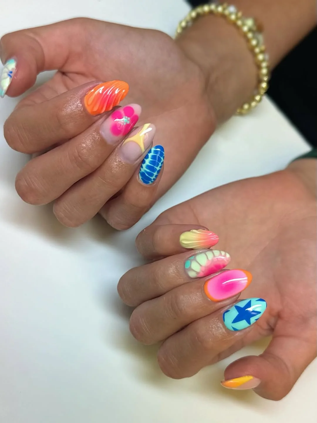 funky summer nails 2026 Neon Mixed Almond Nails With Airbrush Gradients And Star Art
