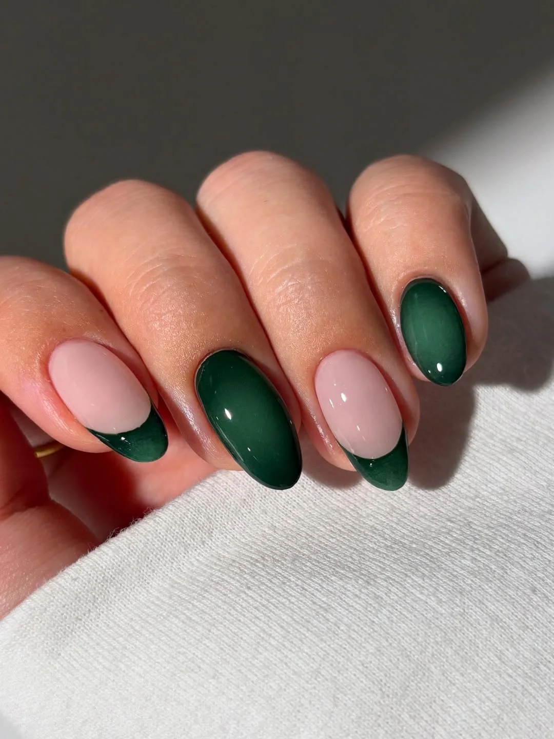 july nail colours ideas 2026 Dark Green French Almond Nails With A Glassy Finish