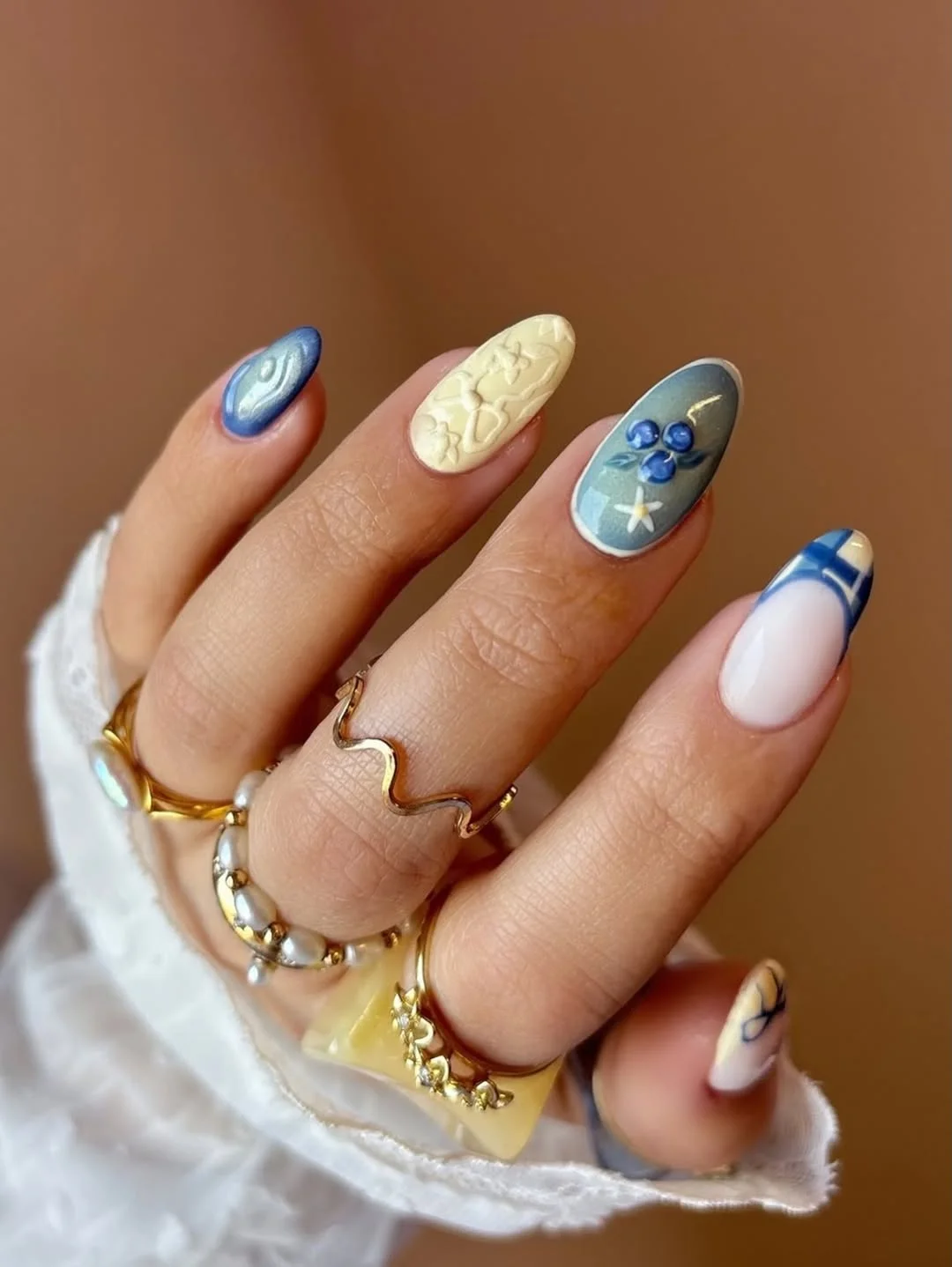 july nail colours ideas 2026 Powder Blue And Cream Vintage Mix Nails