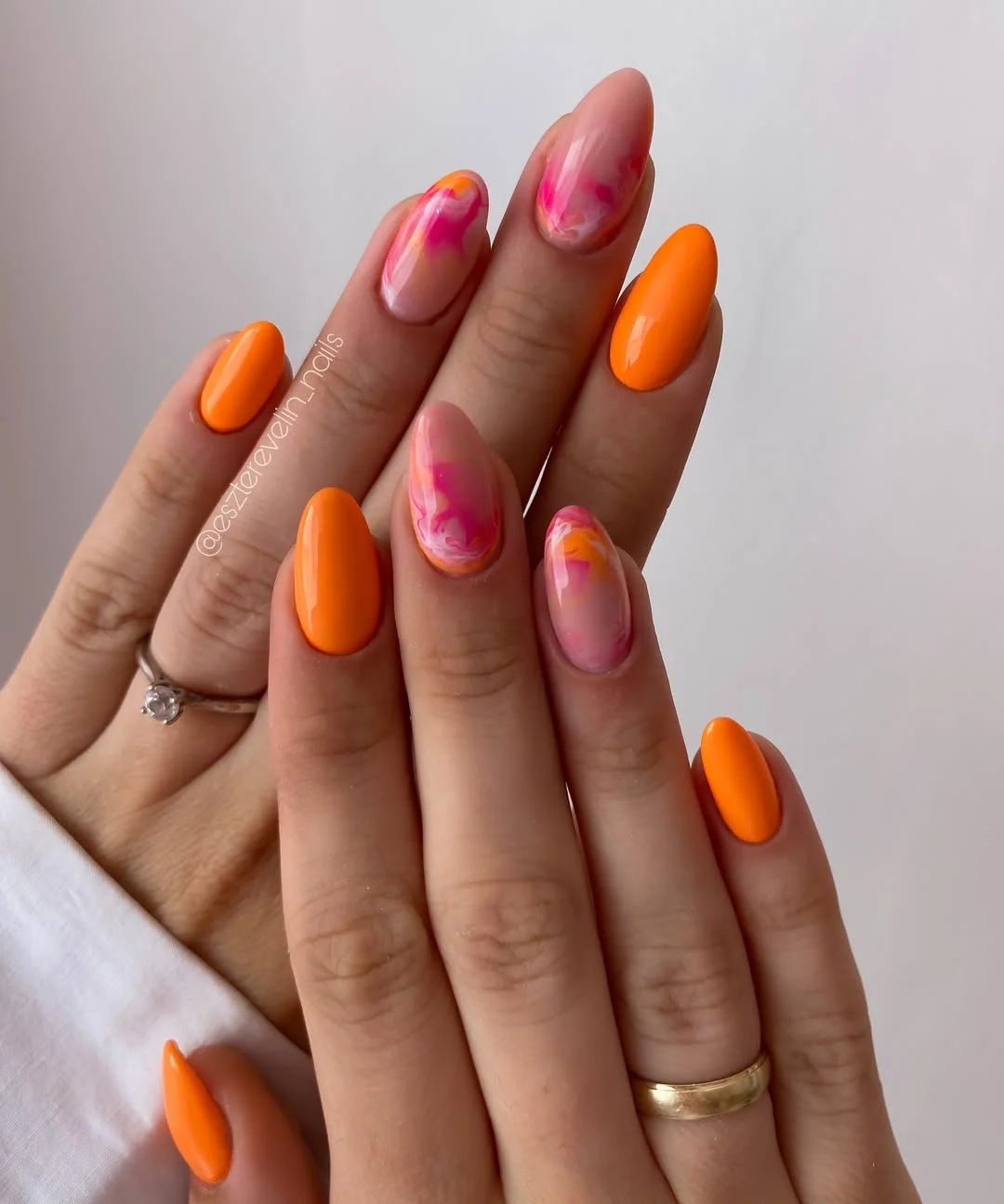 july nail colours ideas 2026 Orange Sorbet Nails With Pink Marble Accents