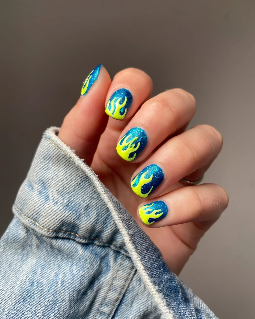 july nail colours ideas 2026 Electric Blue Nails With Neon Flame Art