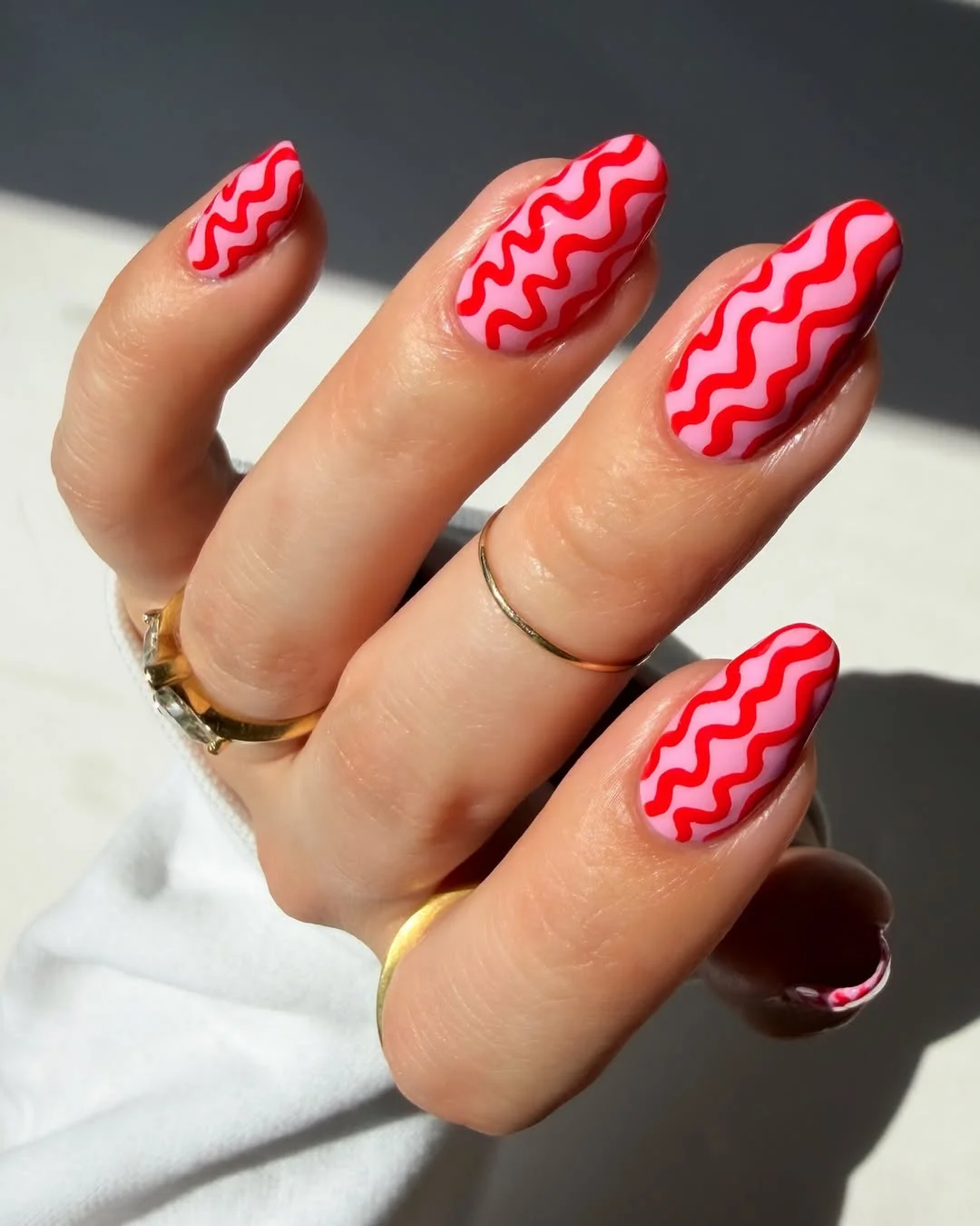 july nail colours ideas 2026 Pink Nails With Red Wavy Summer Lines