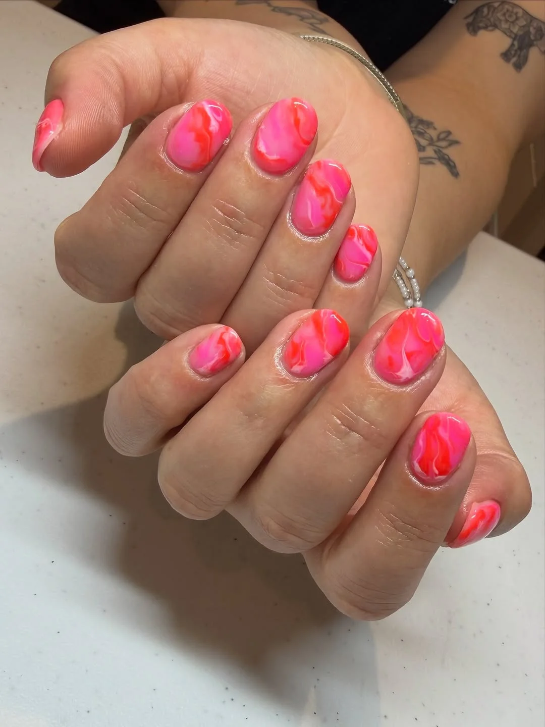 july nail colours ideas 2026 Hot Pink Marble Nails With A Juicy July Finish