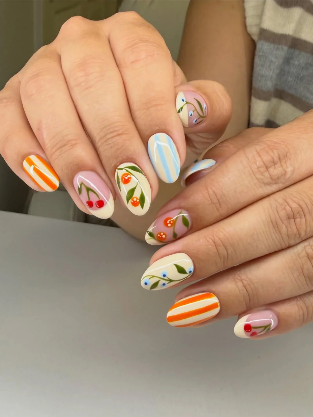 july nails design ideas 2026 Cherry Picnic Nails With Soft Stripes and Fruit Motifs