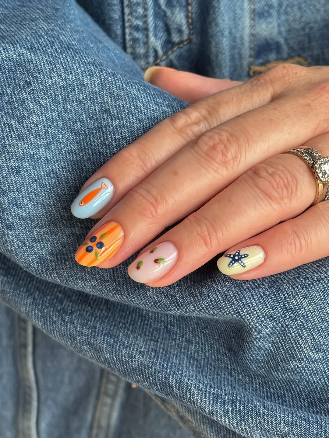 july nails design ideas 2026 Coastal Mini Art Nails With a Starfish Accent