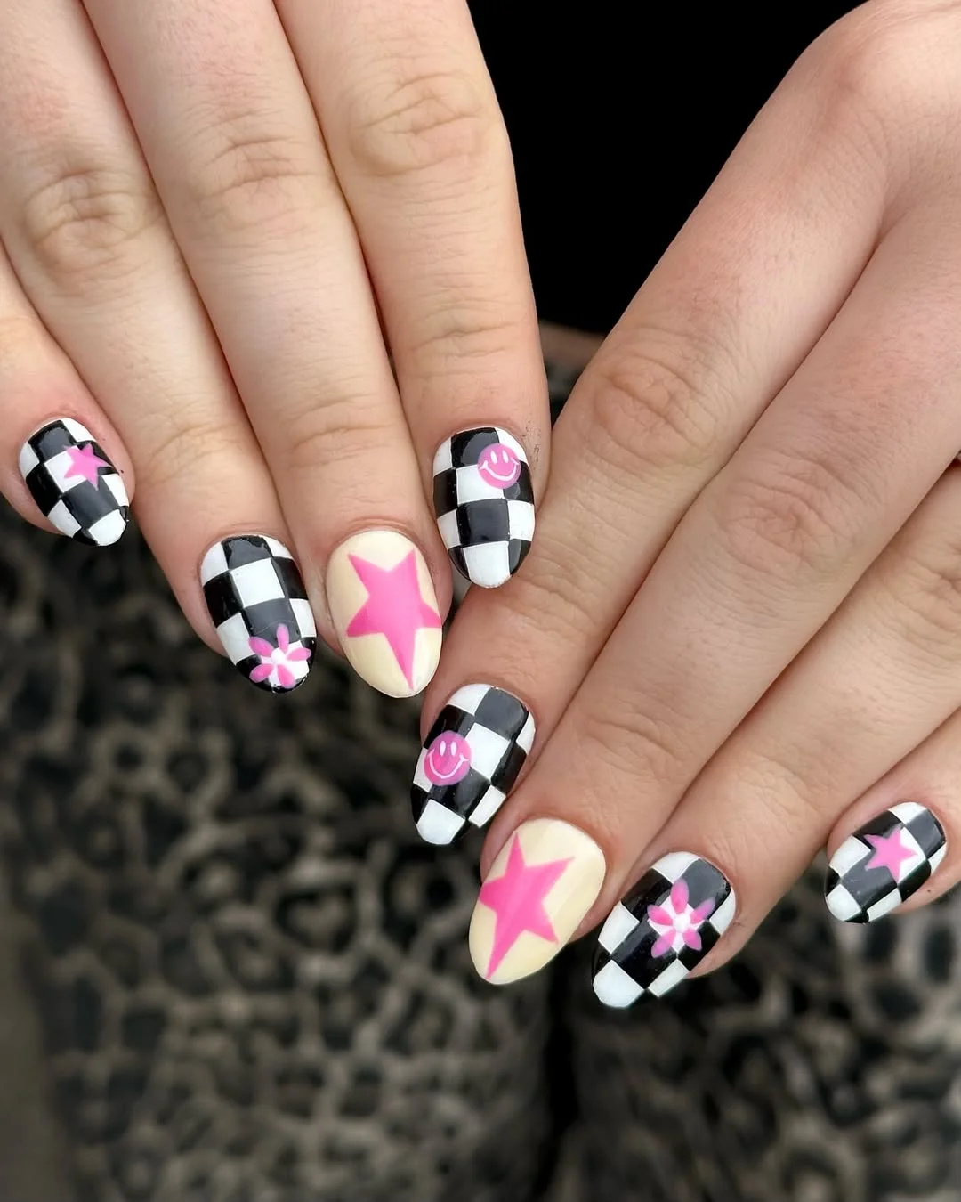 july nails design ideas 2026 Checkerboard Nails With Pink Stars And Smiley Accents