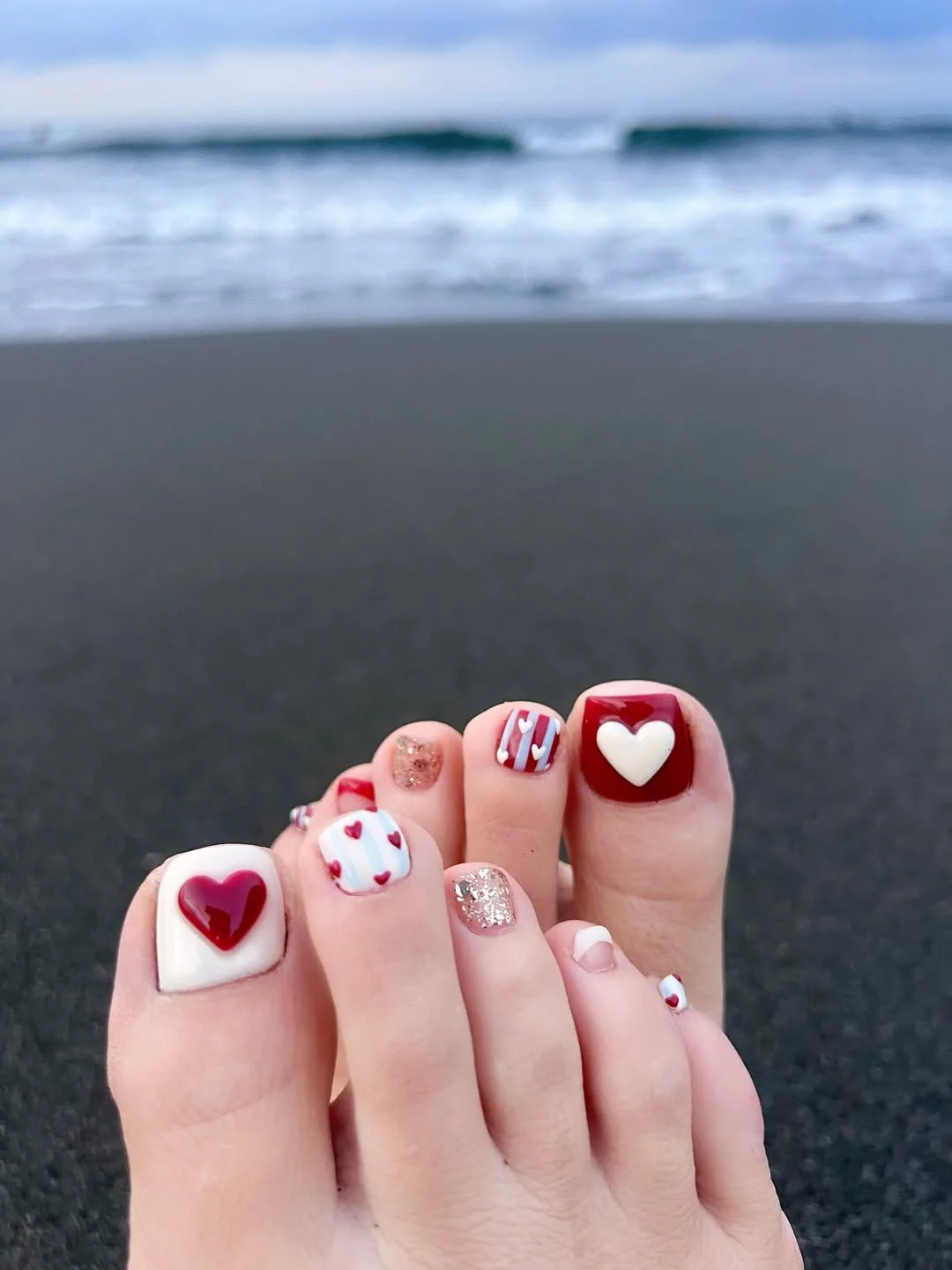 july toe nail colours ideas 2026 Romantic Red Hearts with a Beachy July Twist