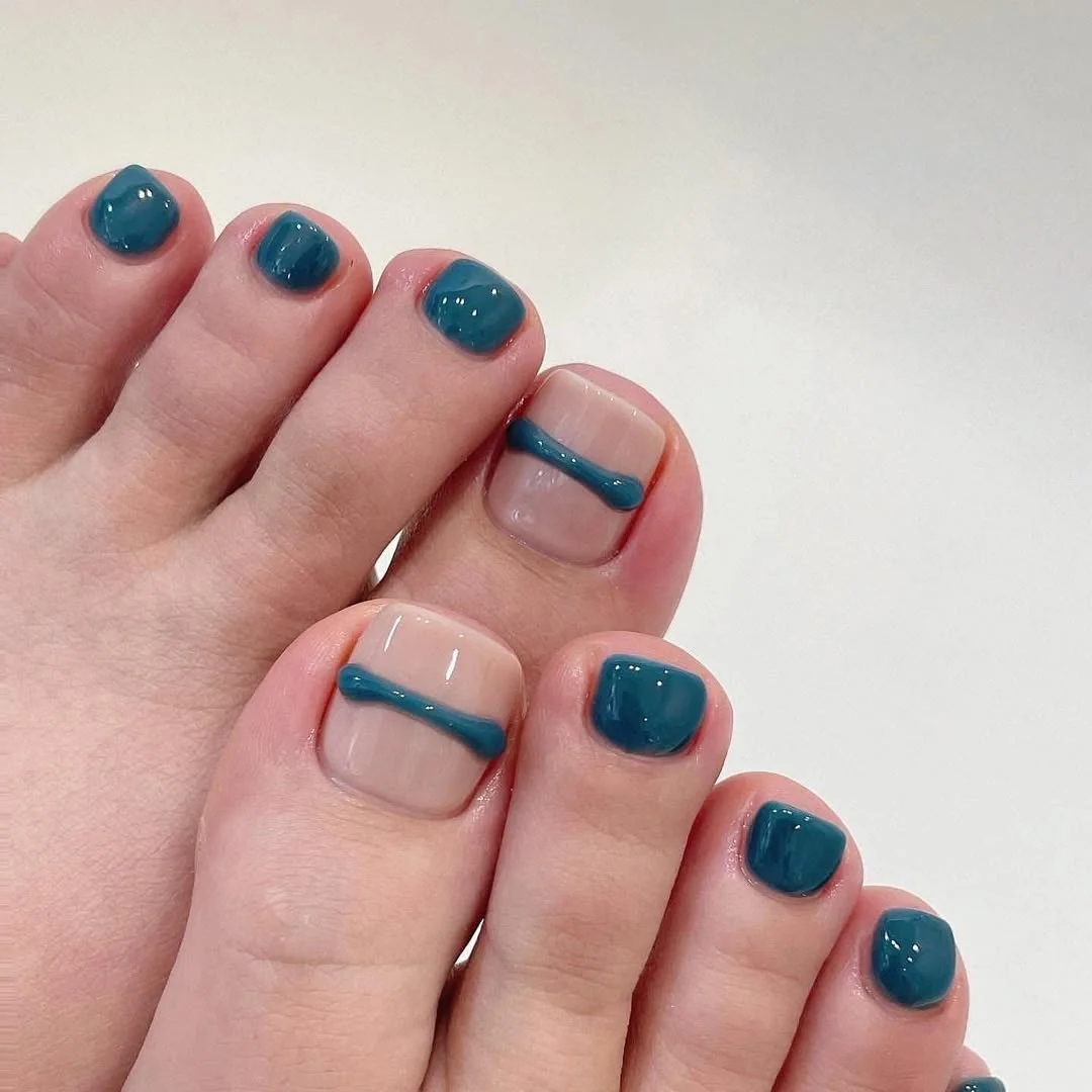 july toe nail colours ideas 2026 Teal Graphic Pedicure with Negative Space