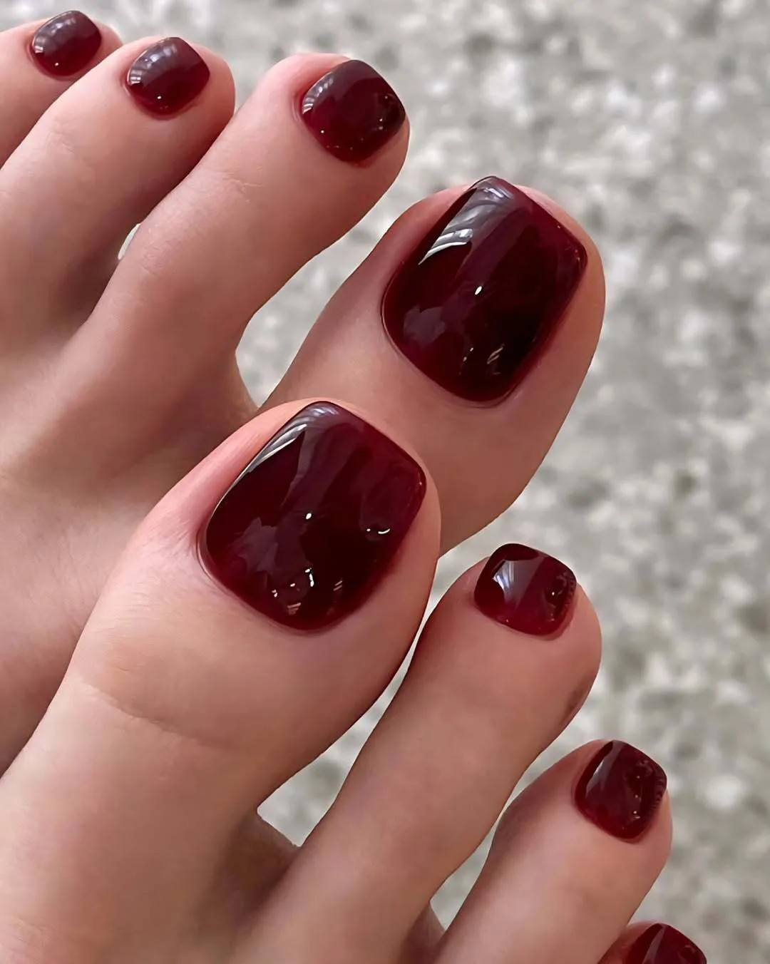 july toe nails design - summer ideas 2026 Jelly Wine Red Toes With a Glassy Finish