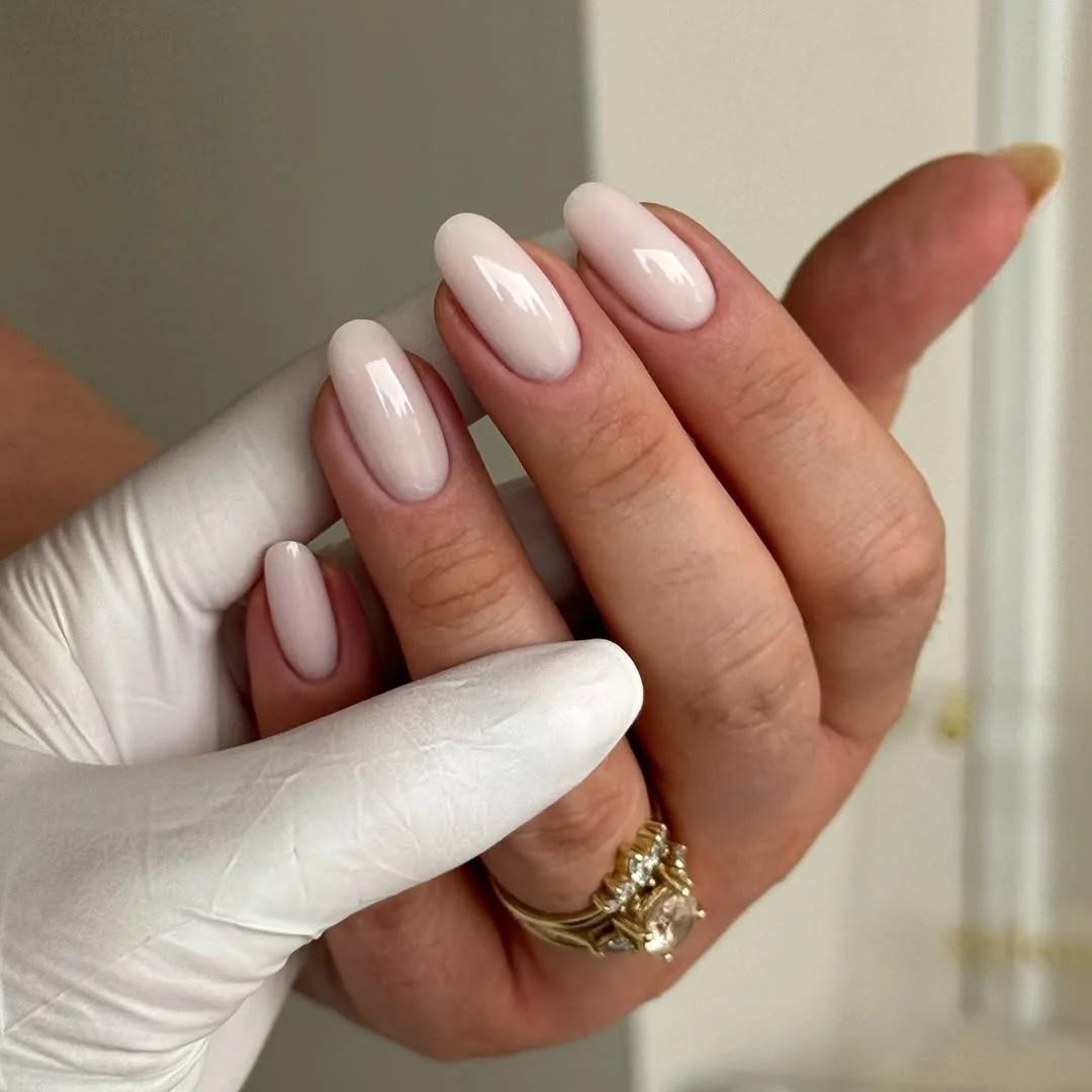 june manicure ideas 2026 Soft Milky White Almond Nails With a Cloudy Finish
