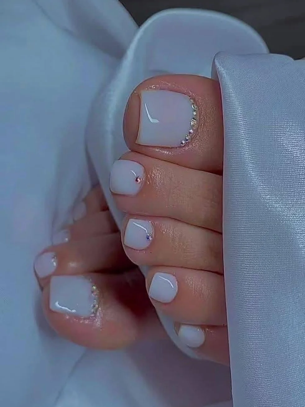 june pedicure ideas 2026 Milky White Pedicure With Tiny Crystal Accents