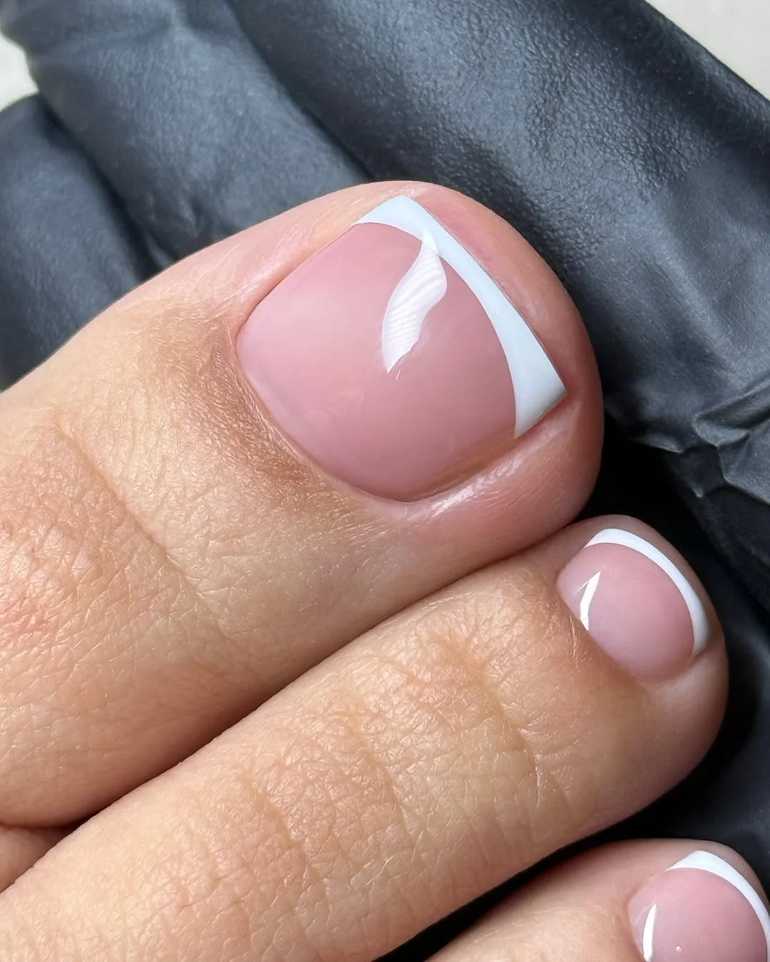 june pedicure ideas 2026 Modern White French Pedicure With a Curved Tip