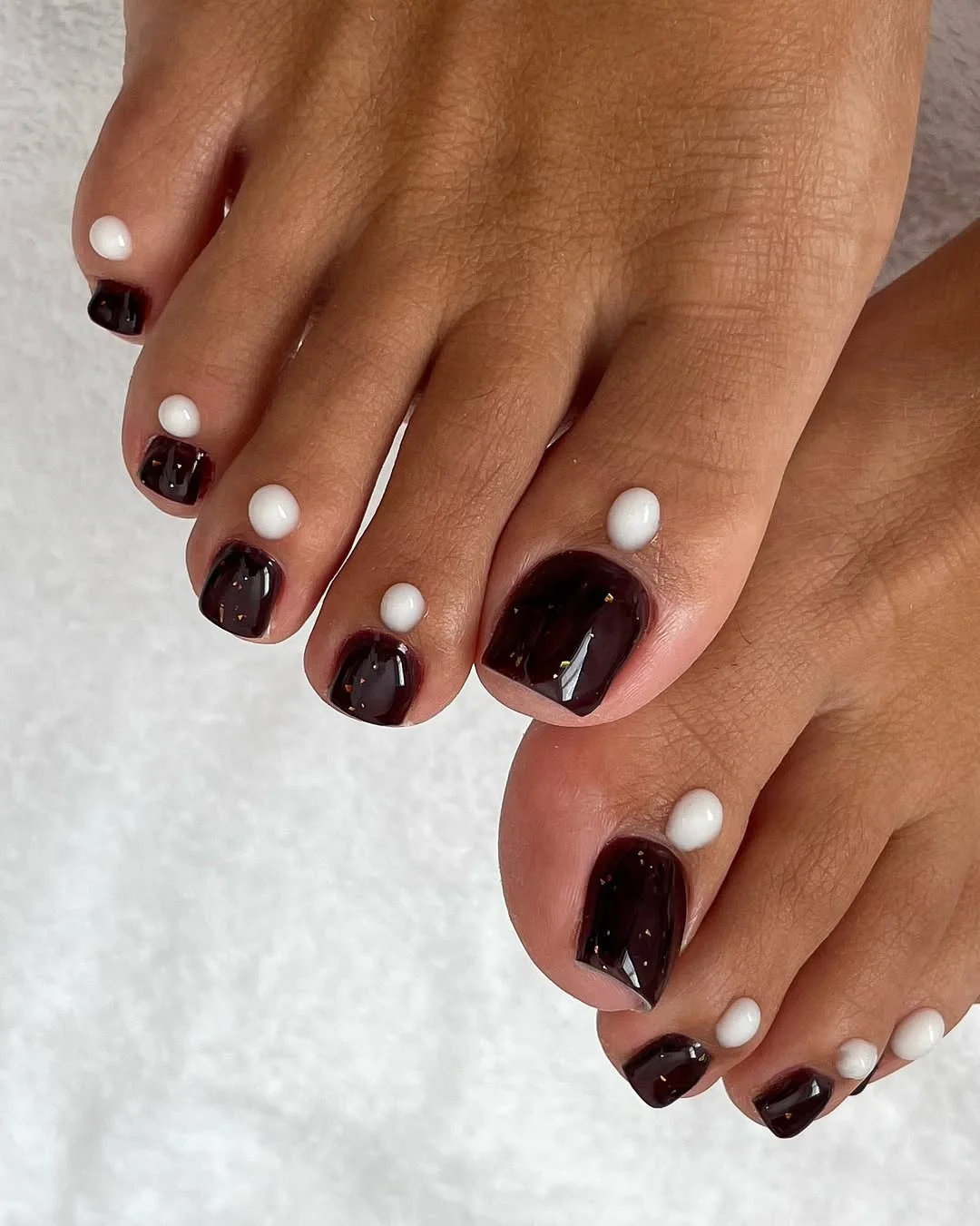 june pedicure ideas 2026 Dark Cherry Pedicure With Pearl-Dot Contrast