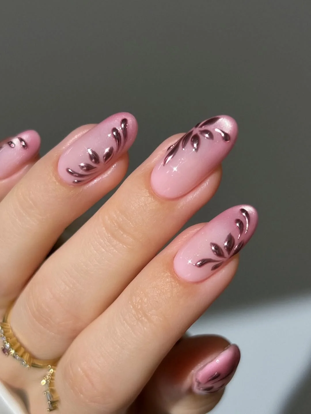 light summer nails 2026 Light Pink Almond Nails With Metallic Leaf Art