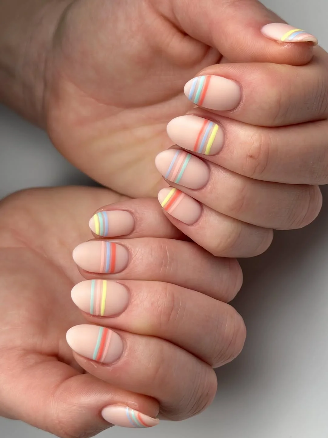 light summer nails 2026 Soft Nude Nails With Pastel Stripe Details