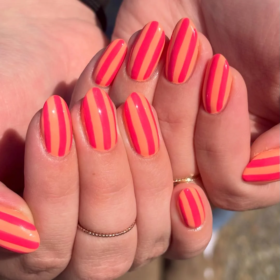 plain summer nails 2026 Hot Coral And Pink Stripes That Feel Like Sunshine