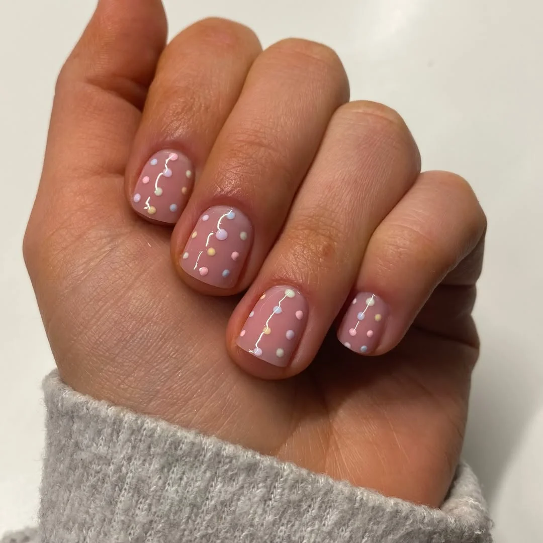 plain summer nails 2026 Pastel Confetti Dots On A Dusty Pink Base