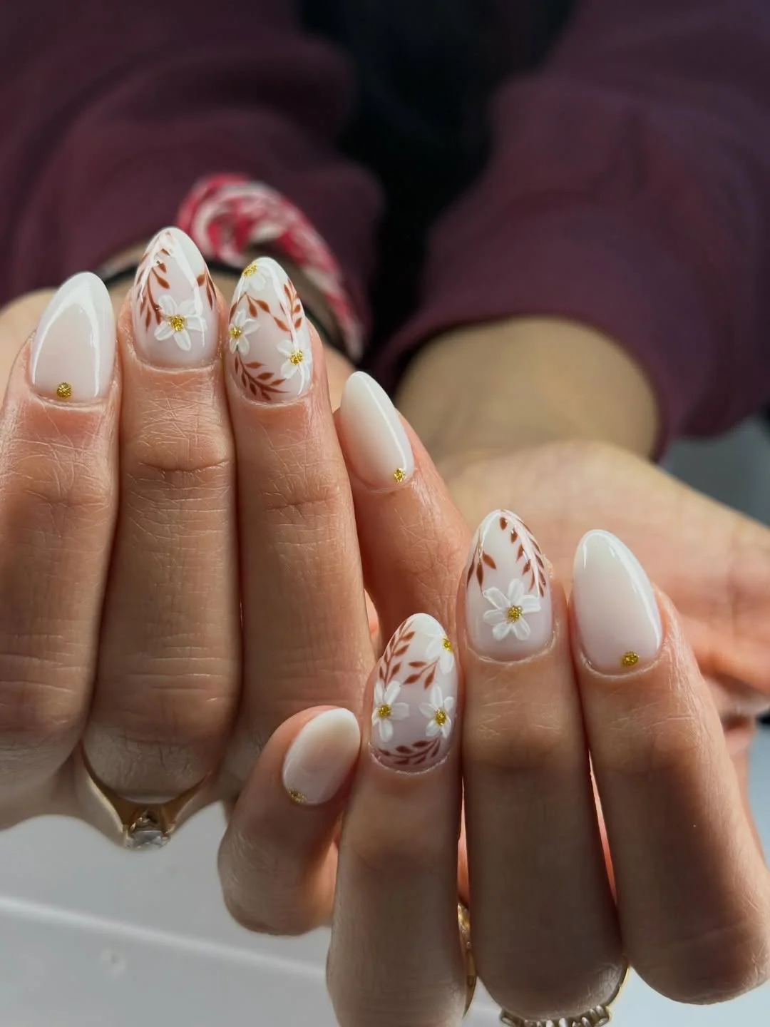 plain summer nails 2026 Milky Floral Almond Nails With Golden Details