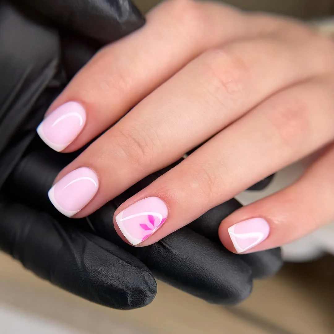 plain summer nails 2026 Short Pink French Nails With A Tiny Floral Accent
