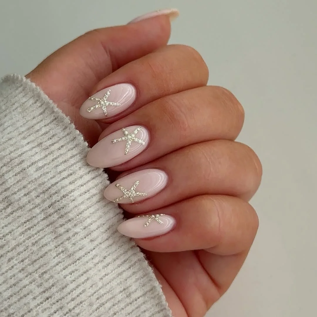 starfish summer nails 2026 Minimal Milky Almond Nails With Delicate Crystal Starfish