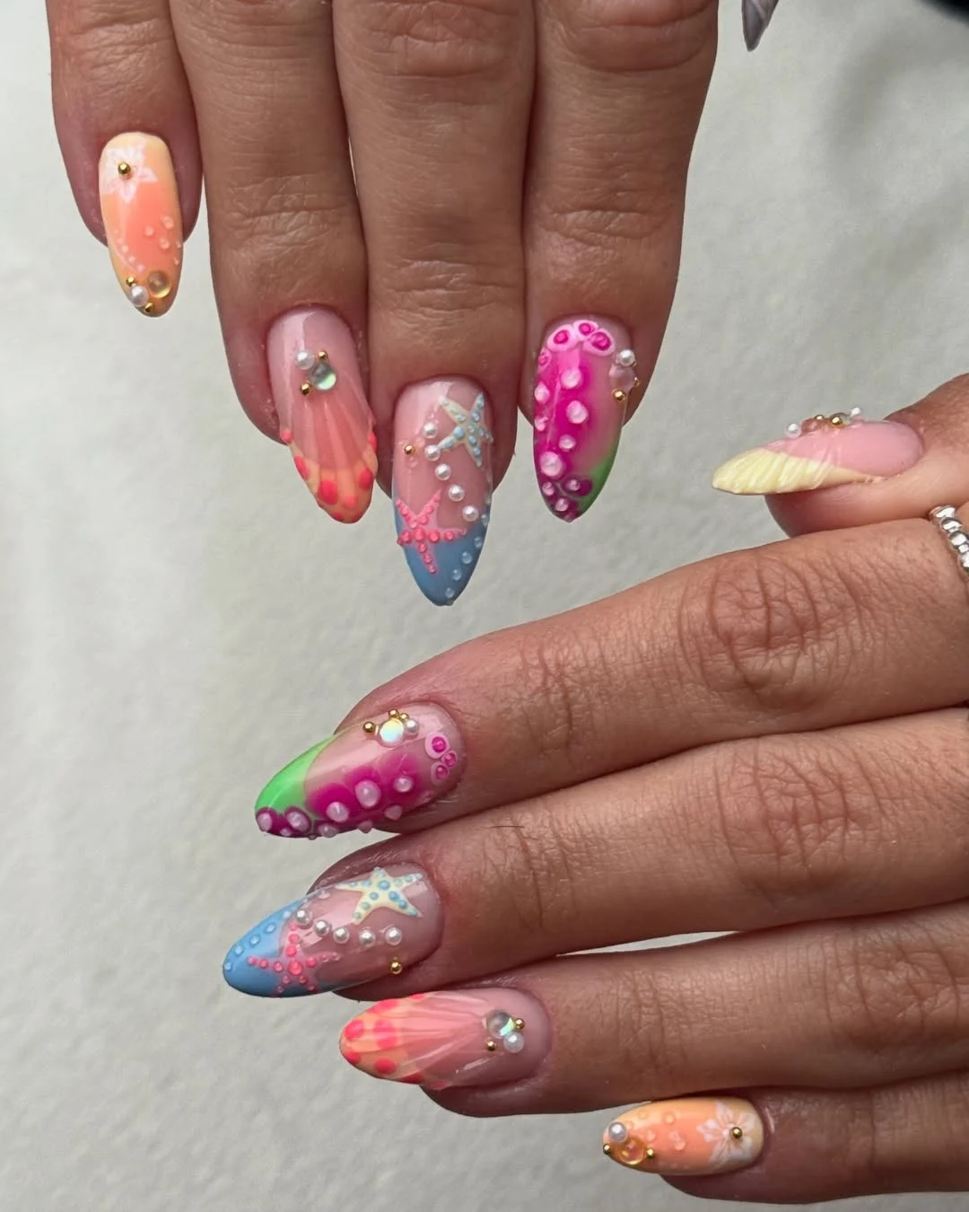 starfish summer nails 2026 Bright Tropical Sea Life Nails In Pink, Blue, And Orange