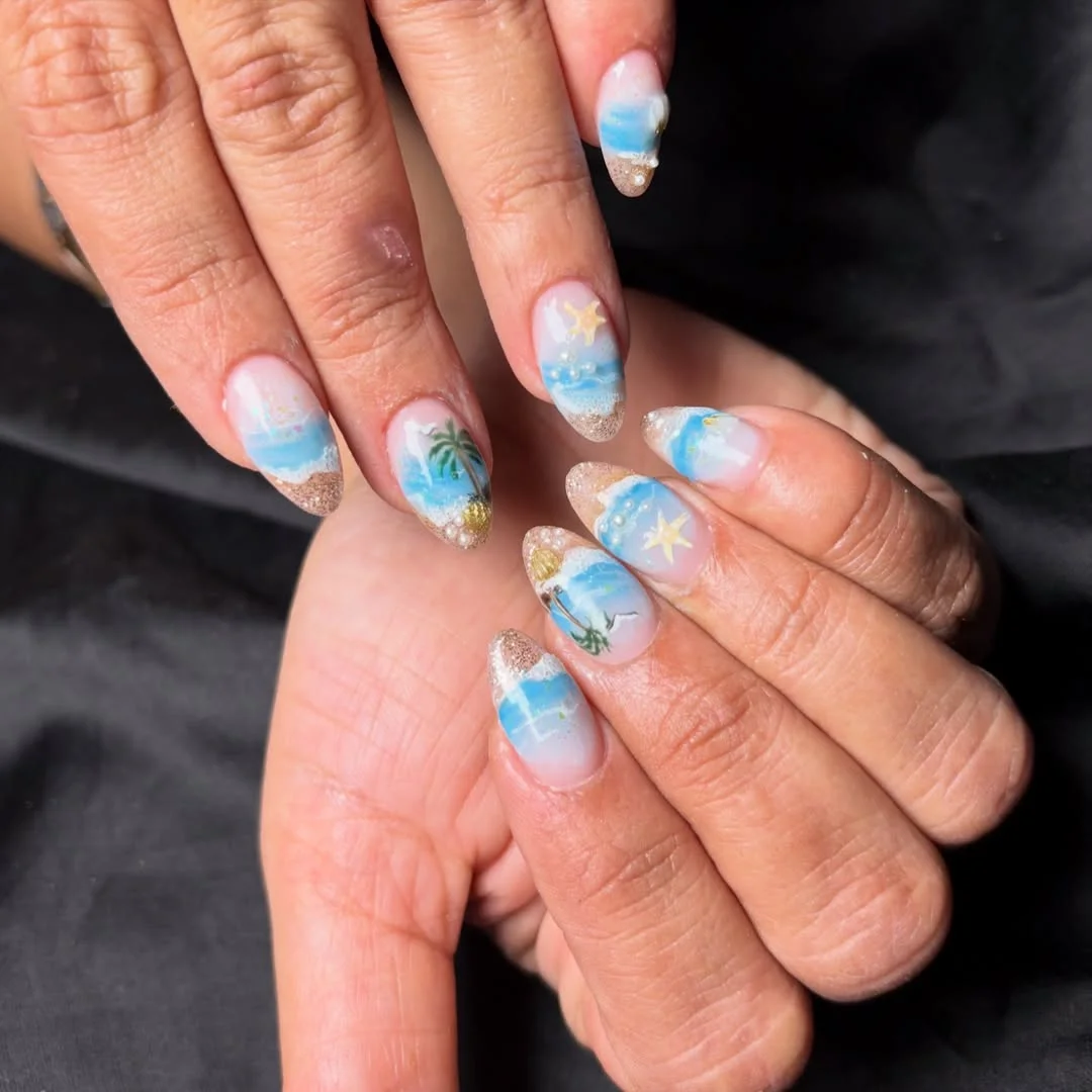 starfish summer nails 2026 Soft Blue Beach Scene Nails With Tiny Starfish Accents