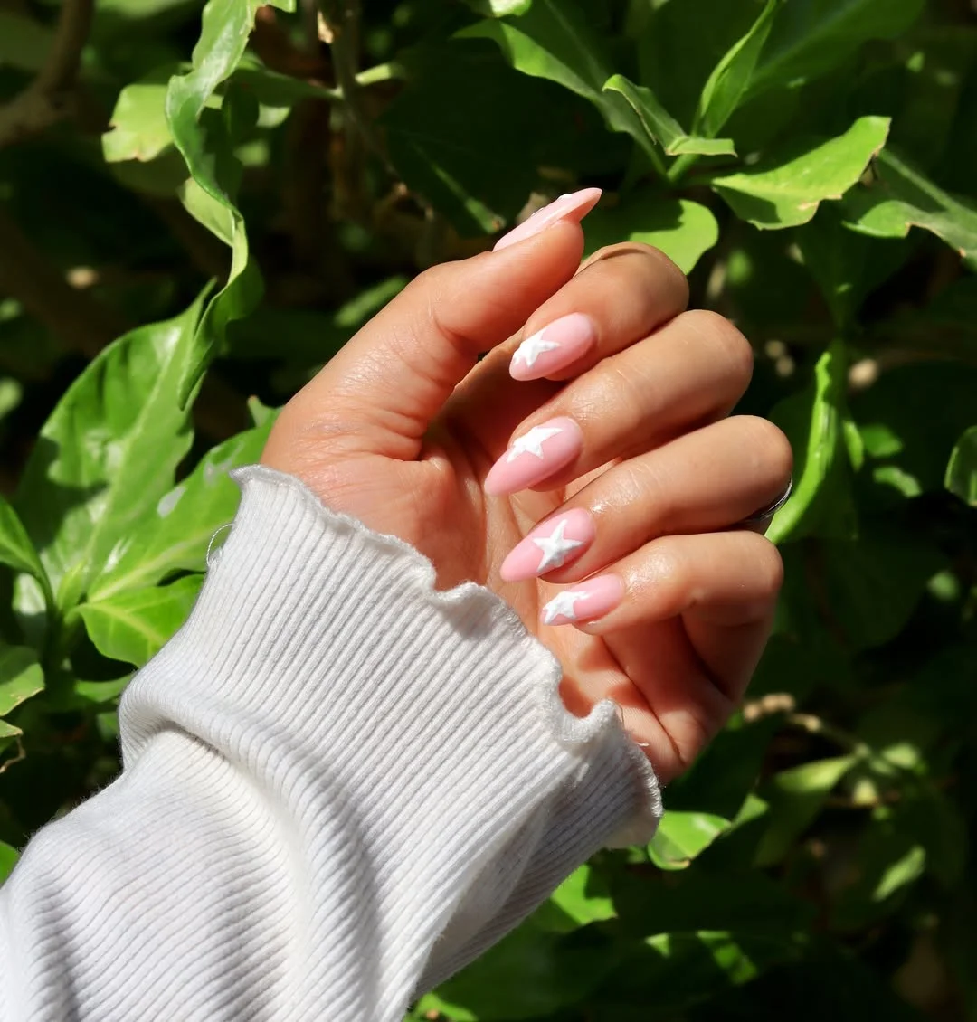 starfish summer nails 2026 Soft Pink Almond Nails With White Starfish Accents