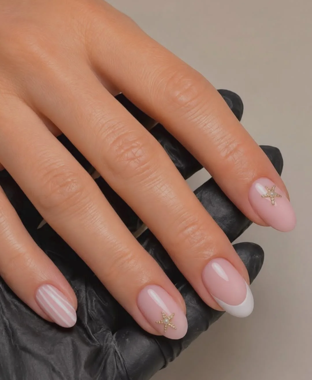 starfish summer nails 2026 Classic French Almond Nails With Tiny Gold Starfish