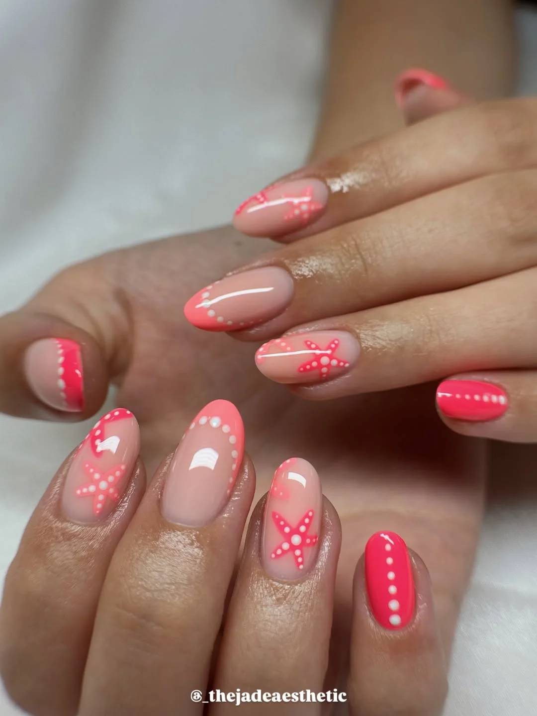 starfish summer nails 2026 Coral Pink Starfish Nails With Glossy Summer Dots